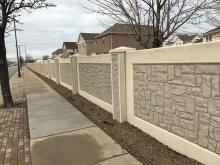 Two-color concrete stain system on exterior precast stone wall