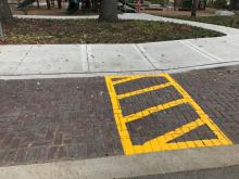 Parking lot striping and safety walkway painting.