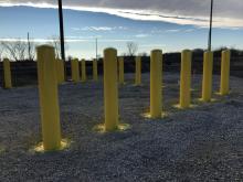 Painting of exterior pipe bollards at Union Pacific Railroad.
